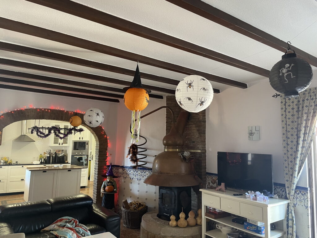 halloween decorations in a kitchen and living room area in portugal.